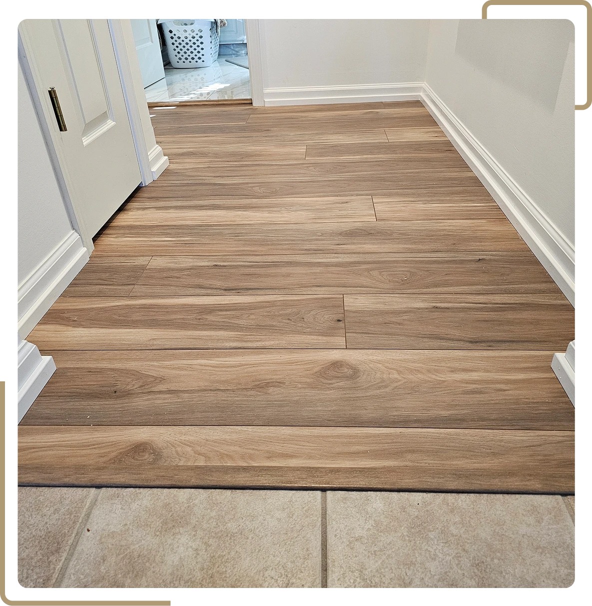 Modern wood floor connecting to tiled area