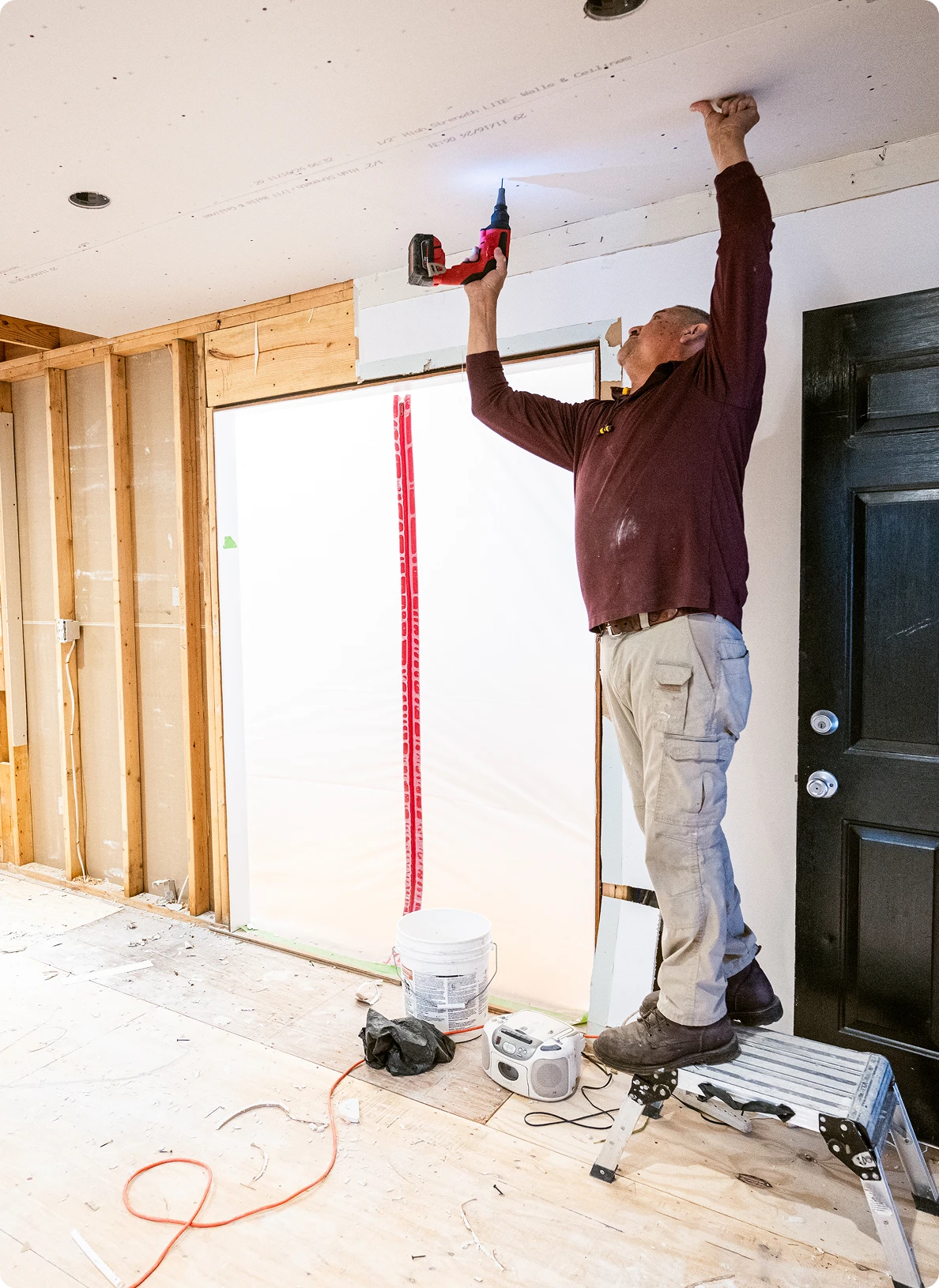Construction worker on stepladder